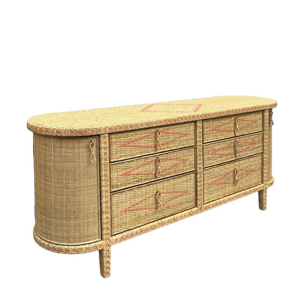 A mid-century modern woven rattan sideboard or dresser with a curved front, six drawers, and a patterned woven top and trim, shown on a plain white background.